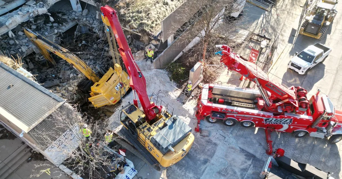World's Largest Rotator Tow Truck Called in After Excavator Falls Through Parking Garage