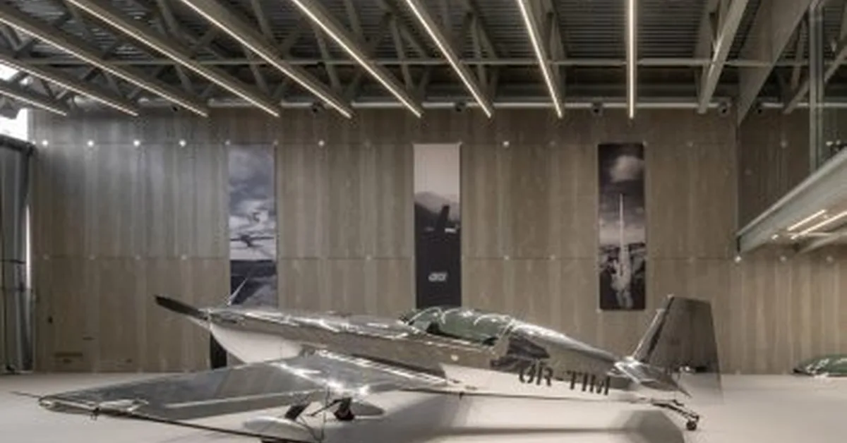 Pluskouple designs monchrome aircraft hangar for Ukraine skydiving collective