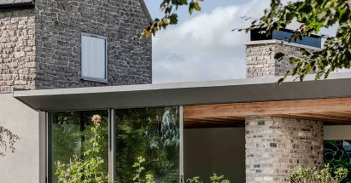 Forgeworks revamps Somerset farmhouse with low-lying stone extension